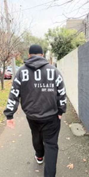 Customer wearing the Melbourne Patriot hoodie on a Melbourne street